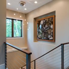 Stairwell With Art and Chandelier