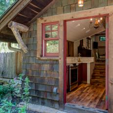 Rustic Cabin Exterior With Red Trim
