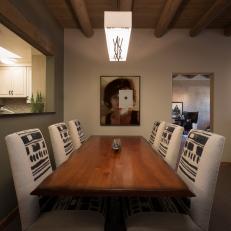 Transitional Dining Room Centers on Artwork