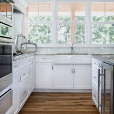 Bright White Farmhouse Sink in Contemporary Kitchen