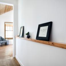 Contemporary White Hall With Picture Shelf