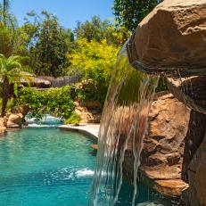 Tropical Pool With Soothing Waterfall