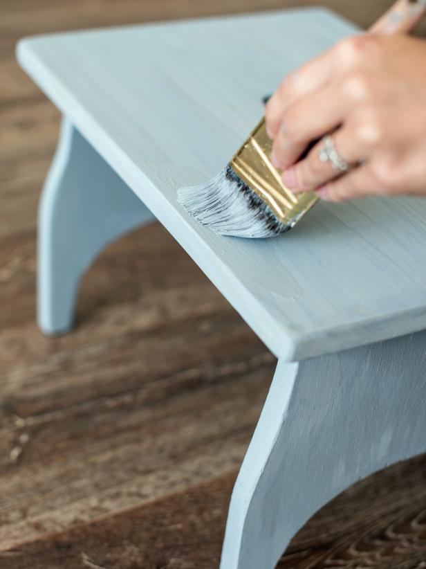 Wipe away dust from sanding with a damp cloth. Apply paint, stain, and/or finish to stool to achieve desired look.