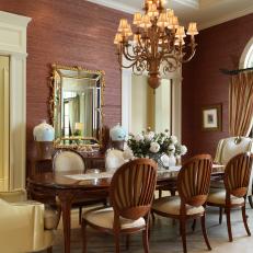 Rose Dining Room With Ornamental Traditional Chandelier and Sophisticated Decor 