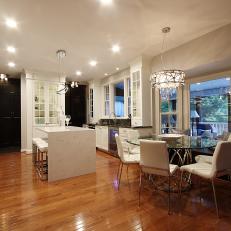 Spacious Eat In Kitchen Featuring Bay Window Dining, White Fixtures and Mixed Lighting 