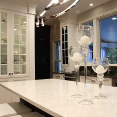 White Island Countertop and Glass Door China Cabinet in Contemporary Kitchen 