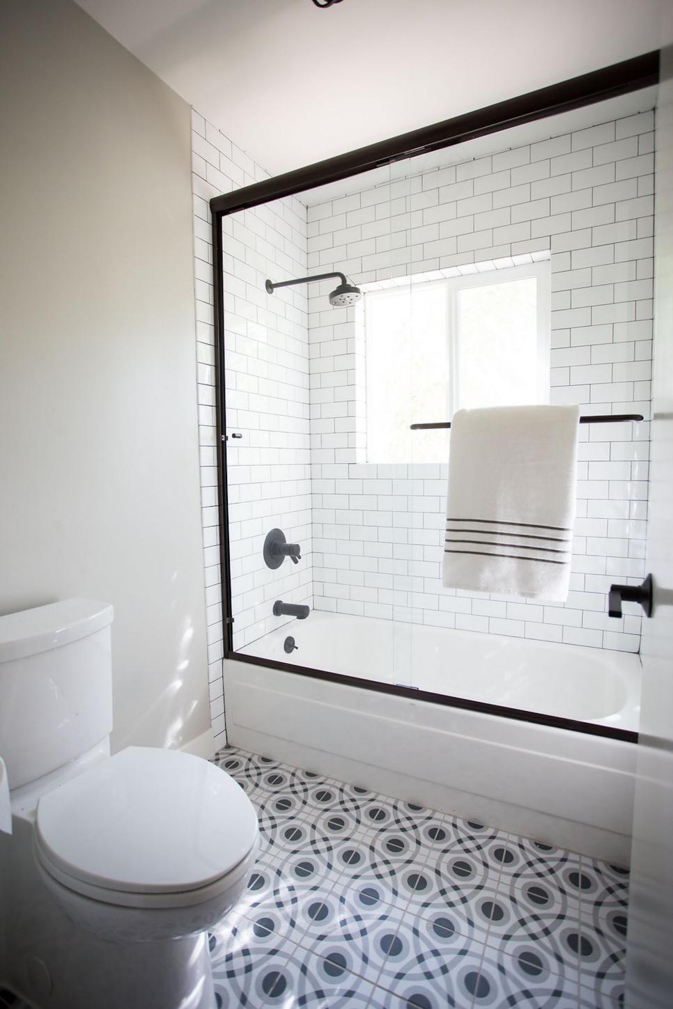 Black and White Bathroom With Patterned Floor Tile and Subway Tile ...