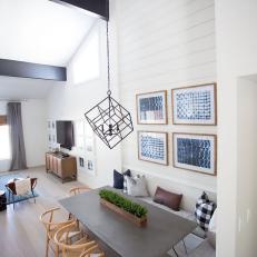 Aerial Dining Room View Featuring Cube Chandelier Over Sleek Gray Table With Built In Bench Seating Aerial Dining Room View Featuring Cube Chandelier Over Sleek Gray Table With Built In Bench Seating