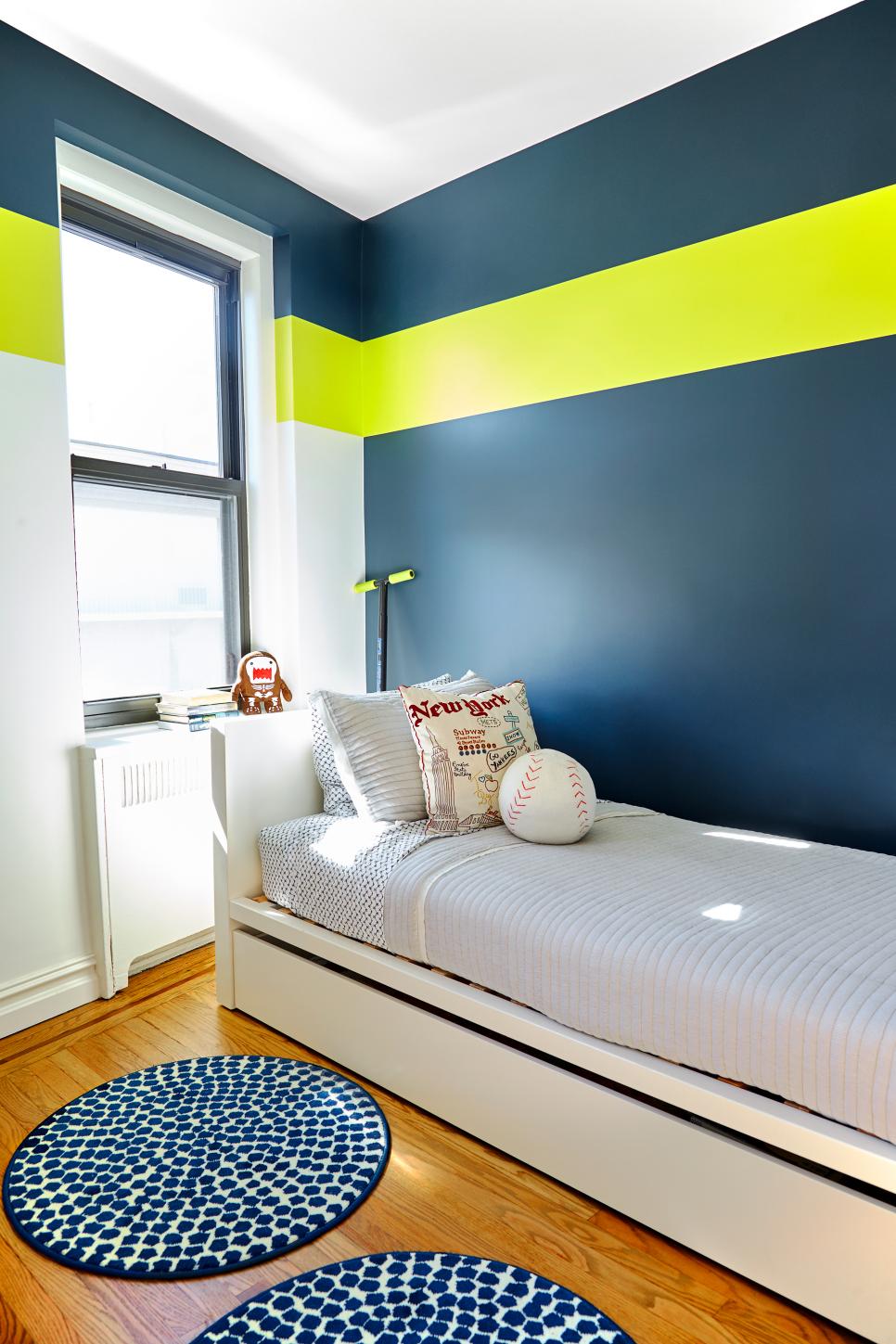 Navy Blue Accent Wall With Neon Stripe Over Twin Bed and