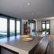 Kitchen With Big Island and Glass Doors