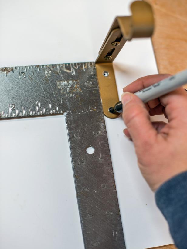 Use square to confirm measurements and make sure hardware is square on the template.  Mark screw holes with a permanent marker.