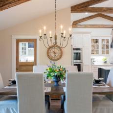 Refined Dining Room With Vaulted Exposed Beam Ceilings