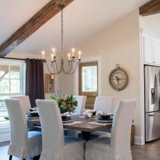 Open Concept Dining Room With Exposed Beam Vaulted Ceilings