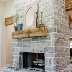 Light and Bright Living Room With Gray Stone Fireplace and Reclaimed Wood Mantel
