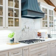 Light and Bright Kitchen With Blue Range Hood
