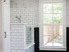 Black and White Mud Room With Dog Shower and Black Wainscoting