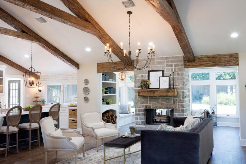Neutral and Gray Living Room With Exposed Beam Vaulted Ceilings