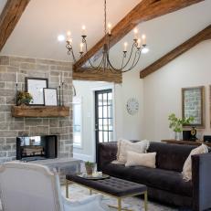 Open Concept Living Room With Nearby Sunroom and Exposed Beam Vaulted Ceilings