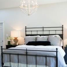 Light and Bright Master Bedroom With Black Metal Bed Frame