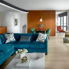 Midcentury Living and Dining Room With Blue Sofa