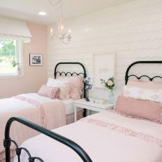 Shabby Chic Girl's Dollhouse Bedroom With White Shingle Accent Wall and Ruffled Blush Bed Linens