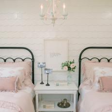 Frilly, Feminine Blush Bed Linens in Girl's Bedroom With Wood Shingle White Accent Wall 