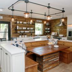 Eat In Open Kitchen With Built in Bench Seating, Industrial Track Lighting and Natural Wood Elements 