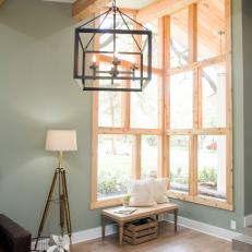 County Living Room Chandelier and Cedar Wrapped Window Grouping 