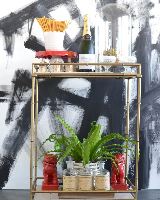 Styled Eclectic Bar Cart with Red, Gold and White Accessories