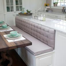 Gray Tufted Banquette and Open Kitchen