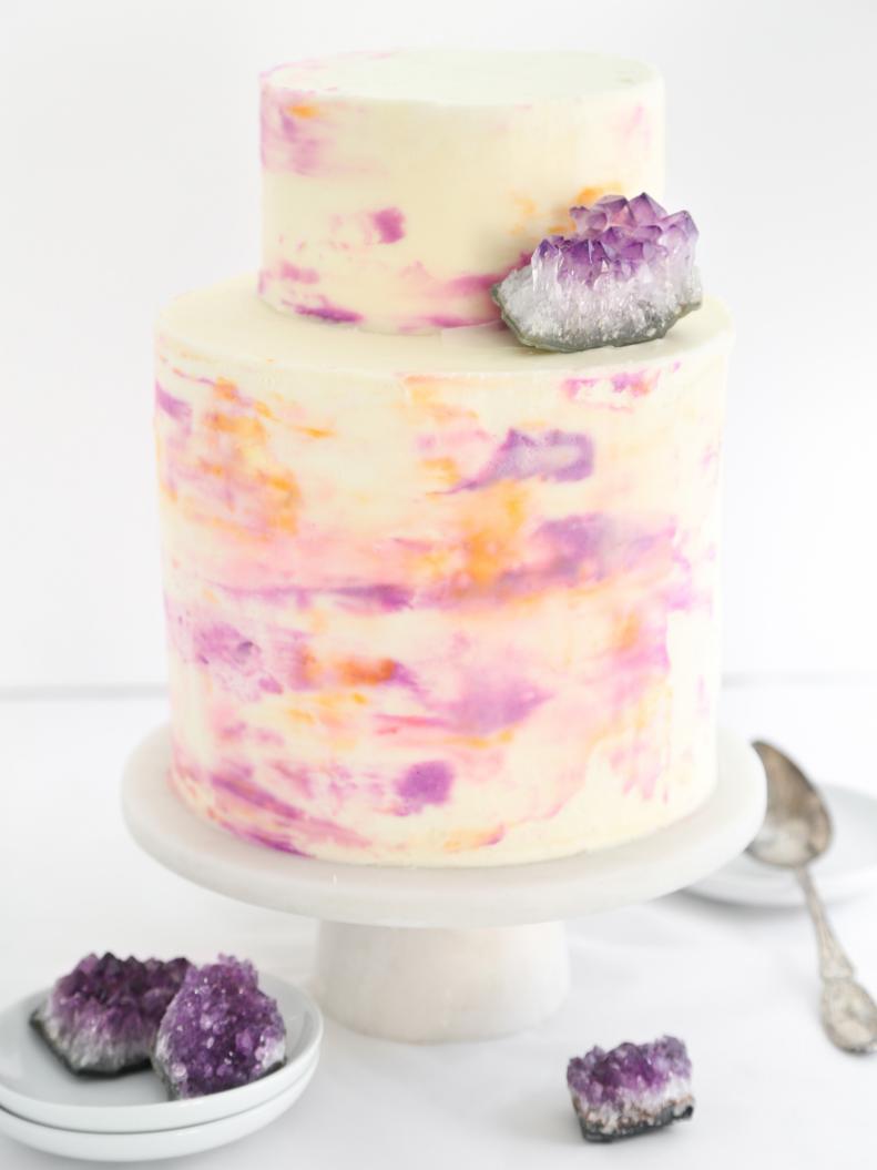 Three-Tiered Watercolor Wedding Cake With Purple Geode Accents