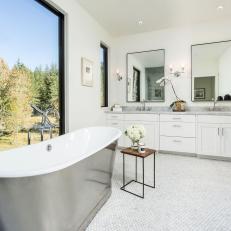 Bright, Contemporary Bathroom With Metallic Bathtub, Double Vanity and Penny Tile Flooring 