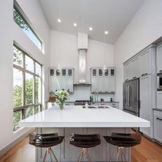 White Galley Kitchen With Glass Pendants