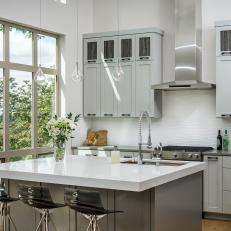 White and Gray Open Plan Kitchen With Window Wall