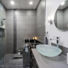 Gray Modern Bathroom With Round Mirror
