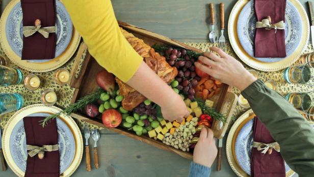 Use strips of bread dough and aluminum foil to create an edible centerpiece for your Thanksgiving or fall table.