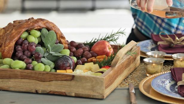 Use strips of bread dough and aluminum foil to create an edible centerpiece for your Thanksgiving or fall table.