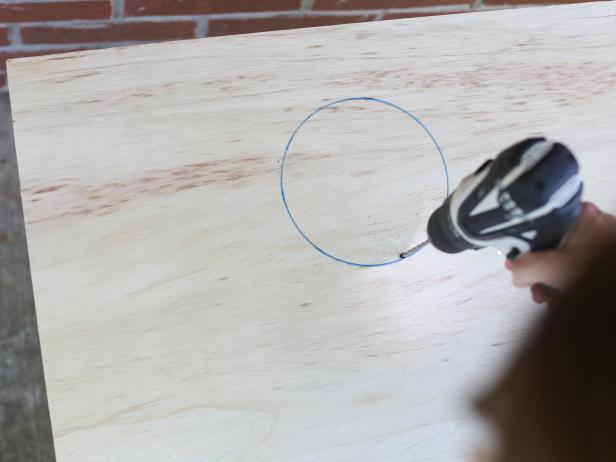 Use a drill to make a hole large enough for the saw blade.