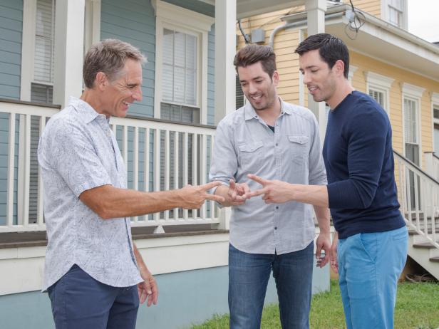 Scott Bakula (NCIS: New Orleans) plays Rock, Paper, Scissors with Jonathan and Drew Scott to determine who will go first in showing their new design, as seen on Brothers Take New Orleans. (action)