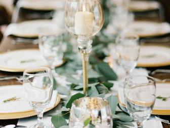 Long Set Table With Greenery Centerpiece and Candles