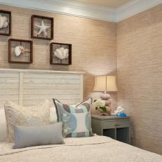 Coastal Bedroom Decor Over Coastal Wood Headboard and Neutral Patterned Bed Linens 