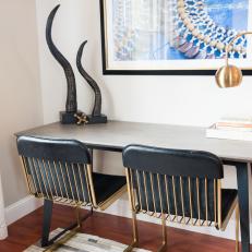 Desk With Black and Gold Chairs