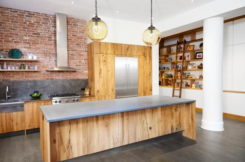 Kitchen In A Loft Style With Concrete And Brick Walls And Tiles A