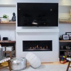 Modern Fireplace With White Surround, Floating White Mantel and Surrounding Natural Wood Shelves
