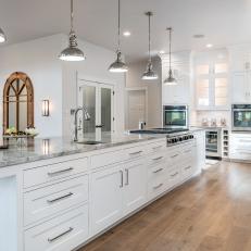 White Open Plan Transitional Kitchen With Industrial Pendants