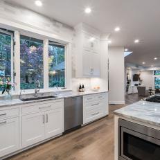 Gray and White Kitchen With Wood Floor