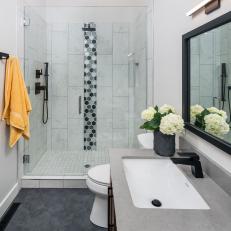 Gray and White Bathroom With Yellow Towel