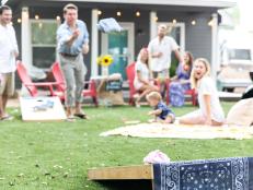 Lawn games were made for informal gatherings like this BabyQ. Lukomski jazzed up the usual beanbags with pink and blue fabric for the event, turning a standard game of cornhole into a baby-gender guessing game.