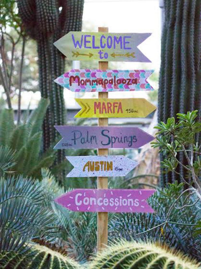 For a bit of festival-inspired whimsy, a directional sign featuring places both near and far is the way to go! Simply cut out cardboard arrows and paint or wrap with pretty paper. Decide on your destinations, then adhere each to a thin wooden stake with tacks, staples or adhesive Velcro strips.