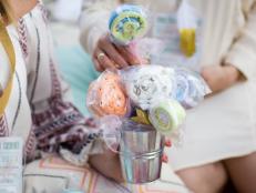 Guests were invited to create adorableâ  and useful!â  baby-washcloth lollipops. Instructions were tucked in with the invitations; find out how to make them with our tutorial here.